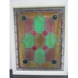 An early 20th Century stained glass panel, overall size 82 cm x 66 cm