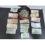 A small collection of various bank notes and coins
