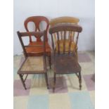 Two farmhouse chairs, a Victorian chair, along with one other.