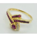 A ruby and diamond snake ring set in 18ct gold.