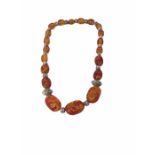 An amber fleck necklace, weight 61.4g