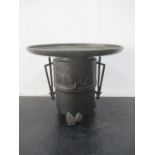 A Japanese bronze censer with pine cone tripod feet and silver details