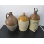 A saltglazed flagon, along with two stoneware cider flagons, one marked Whiteways Devon Cyder