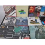 A collection of 12" vinyl records including The Beatles, The Who, Simon & Garfunkel, Beach Boys,