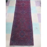 A small red ground runner- approx 152 cm length