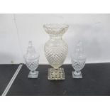 A pair of glass urns with covers, along with a large glass vase (A/F chips to base).