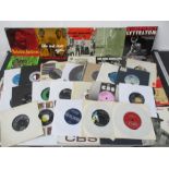 A collection of 7" vinyl singles including The Beach Boys, Boomtown Rats, Cozy Powell, Dire Straits,