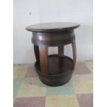 An oak barrel table - height 68cm, top diameter 58cm