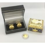 A 22ct gold 'half crown' (Weight 1.1g) along with London Mint cuff links 'St George Dragon' and a