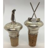 Two hallmarked silver golf themed bottle stoppers