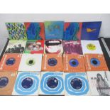A collection of 7" vinyl singles including The Rolling Stones, The Beatles, The Who, Queen, Madonna,