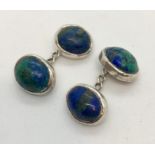 A pair of Lapis Lazuli cuff links set in white metal