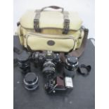 A Nikon F-301 camera along with 3 lenses including Sigma and Hoya etc.
