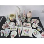 An assortment of Radford's pottery including jugs, vases, small dishes etc
