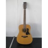 A Tanglewood twelve string handcrafted electro-acoustic guitar with carry case - model number