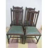 A set of four oak dining chairs with barley twist legs