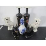 A pair of Staffordshire dogs, along with a pair of cow creamers (both A/F), pair of vases,