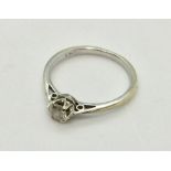 A diamond solitaire ring set in 9 ct gold