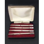 A cased set of 4 Sterling silver bridge pencils- 1 A/F