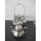A Chanel porcelain tea set with silver colour glaze all decorated with the Chanel logo on stand- tea