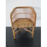 A child's wicker chair - height 49cm