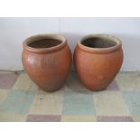 A near pair of large garden pots