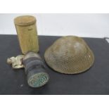 A British steel military helmet along with a gas mask