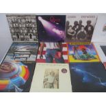 A collection of 12" vinyl records including Led Zeppelin, Queen, ELO, Jefferson Starship, The Doors,