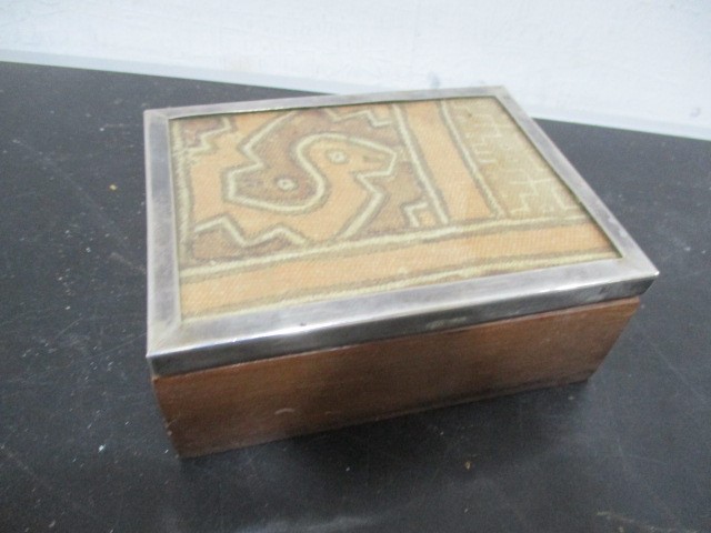 A Peruvian box with 925 silver mounted lid decorated with fabric