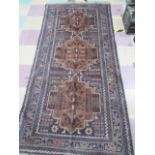 A handwoven blue ground rug, approx 222cm x 105cm