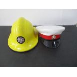 A Royal Marines cap, along with a Central Region fireman's helmet.