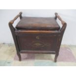 An Edwardian piano stool