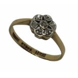 An 18ct gold diamond cluster ring. Size M