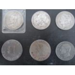 A small collection of coins- Victorian Crown, 1897 Liberty silver dollar, two $1 tokens etc.