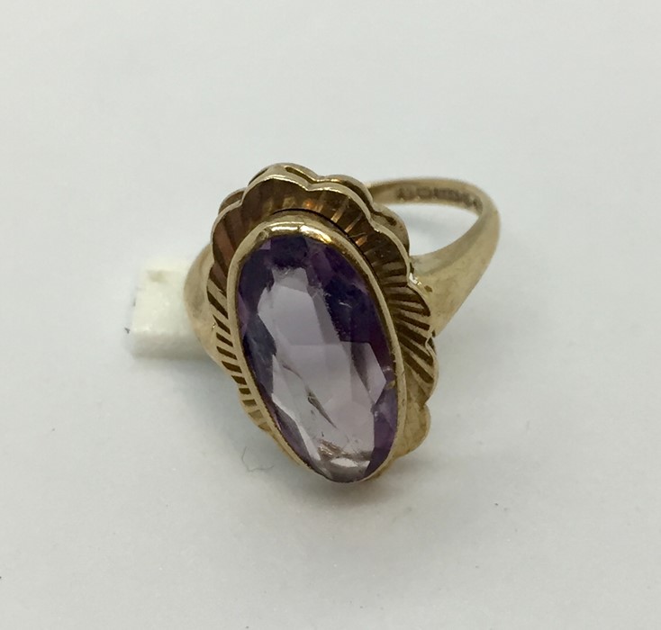 A 9 ct gold ring set with large amethyst