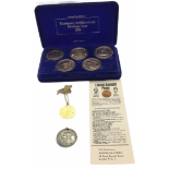 A cased set of European Architectural heritage medallions along with a silver gilt medallion,