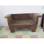 A rough hewn carved bench - A/F