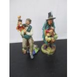 Two Royal Doulton figurines including The Puppet Maker & The Mask Seller.