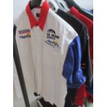 A collection of F1 and motorsport related t shirts etc.