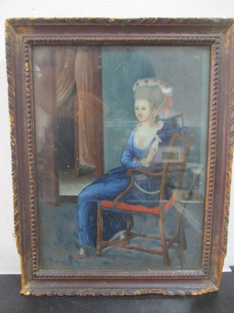 An early 19th Century Chinese reverse painting on glass of a seated lady- A/F