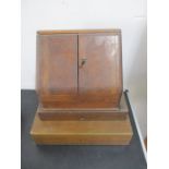 An oak stationary cabinet, along with two other vintage wooden boxes