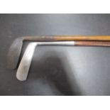 Two vintage golf clubs, a Thomas Harower hickory shafted driving iron along with a Gibson & Son