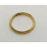 A 9ct gold wedding band. Weight 2g