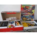 A boxed "Super Saloons" Scalextric set along with C221 accessory set and lap counter extension pack