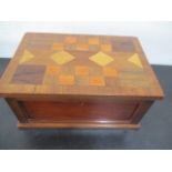 A parquetry box, 27cm x 18.5cm x 13cm