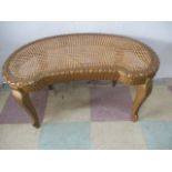 A gilt kidney shaped dressing table stool