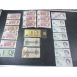 A collection of banknotes including George V ten shilling and £1 note, 6 x unused £5 notes,