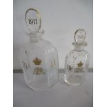 Two glass perfeume bottles, both with gilded date 1911 and the crown and cipher for George V- both