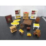 A small collection of wooden dolls house furniture etc.