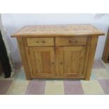 An oak two drawer sideboard with parquetry top